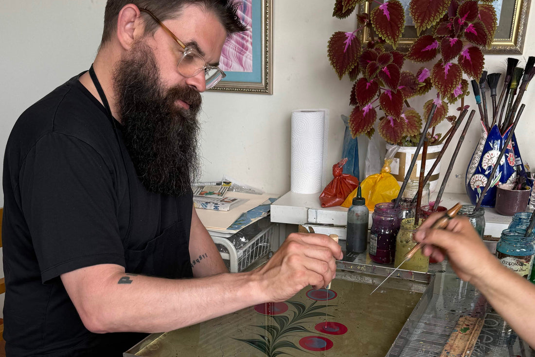 Turkish paper marbling (Ebru) prints with swirling pigment patterns in vibrant colors
