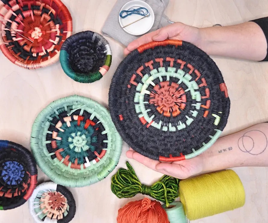 Colorful coiled basket made from reclaimed fibers and vintage yarns by artist Mandy Greer