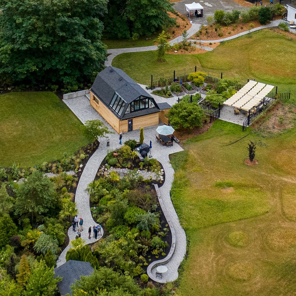 Aerial view of a garden with a house and pathways